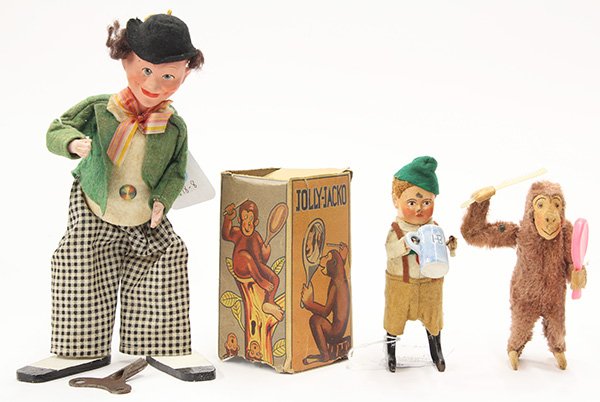 Wind-up toys: (lot of 3) WInd-up toys, consisting of a 1950's C K 'Jolly Jacko' monkey grooming himself, in original box, 5"h, a 1930s Schuco 'Boy drinking from a beer stein', 5.5"h, and a 1930's German character w