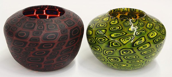 Michael Nourot art glass group: (lot of 2) Michael Nourot art glass group each having a large bulbous form vase having repeating geometric patterns, one executed in crimson, orange, and black, using the Venetian murrini technique on