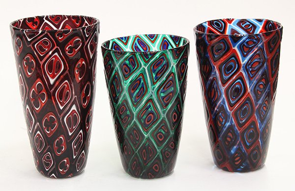 Art glass vases by Michael Nourot (American b.1949): (lot of 3) Art glass vases by Michael Nourot (American b.1949), 1980-1983, each vase of cylindrical form, having repeating geometric patterns executed in the Venetian murrini technique, in multiple co