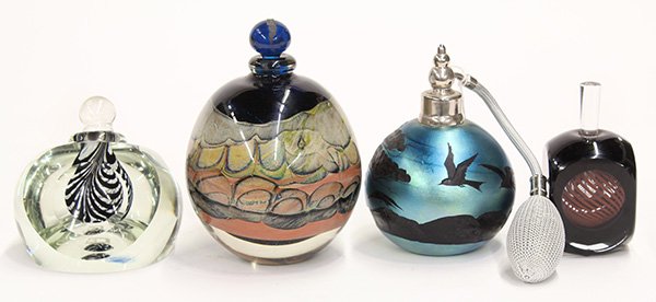 Art glass perfume bottles: (lot of 4) Art glass perfume bottles, executed in cased glass having organic reserves executed in multiple colors by Brent Kee Young, signed Young 78, 5.5"h, one executed in cased glass having a spher