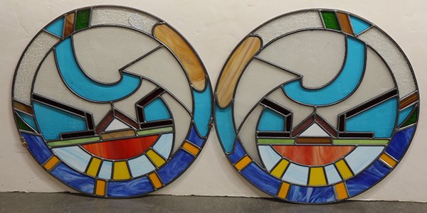 Pop Art style stained glass window inserts: (lot of 11) Pop Art style stained glass window inserts, each having repeating geometric patterns in green, red, yellow, azure, including two circular examples, 21"dia.; together with two Art Nouveau s