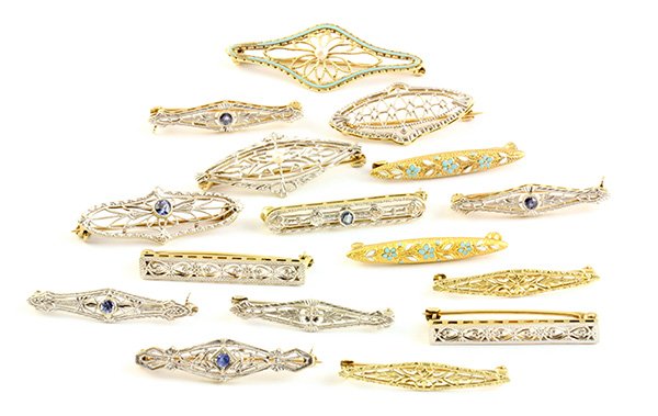 Collection of Vintage pins: (Lot of 16) Vintage 14k yellow gold filigree scarf and sweater pins including three with enamel detailing, seven with gem accents, gross weight for the collection is 17.4 grams