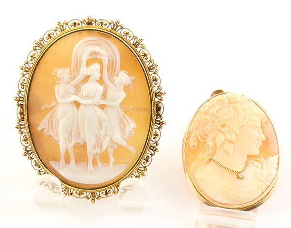 Collection of gold cameo pendant-brooches: (Lot of 2) Cameo and 14k gold brooch-pendants each one is set with an oval shell cameo, one depicting three graces and the other depicting the profile of a lady wearing a diamond necklace, the full cu