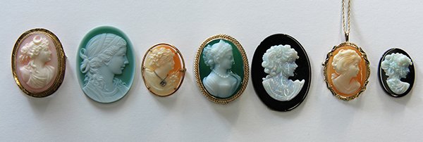 Collection of cameos: (Lot of 7) Collection of cameo jewelry including two shell cameo brooches in 10k yellow gold, one with small diamond necklace detail; two 14k yellow gold pendant-brooches, one shell with neckchain and