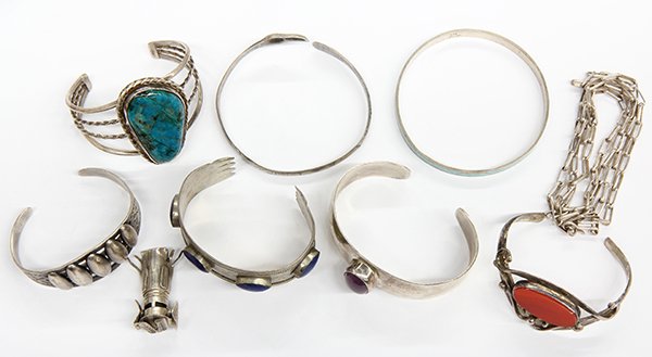 Collection of gem and silver jewelry: Collection of gem and silver jewelry including seven bangle bracelets, two are Native American, (3) rings set with onyx, garnet and a clear stone; (2) pendants, one set with smoky quartz; (1) link cha