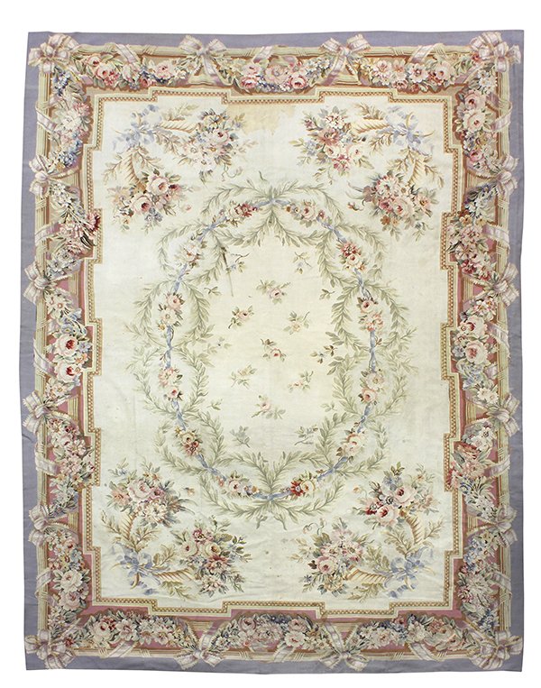 Antique French Aubusson carpet: Antique French Aubusson carpet, the hand woven form with a garland border flanking the floral decorated field centered with the oval medallion, 15' x 11'5"