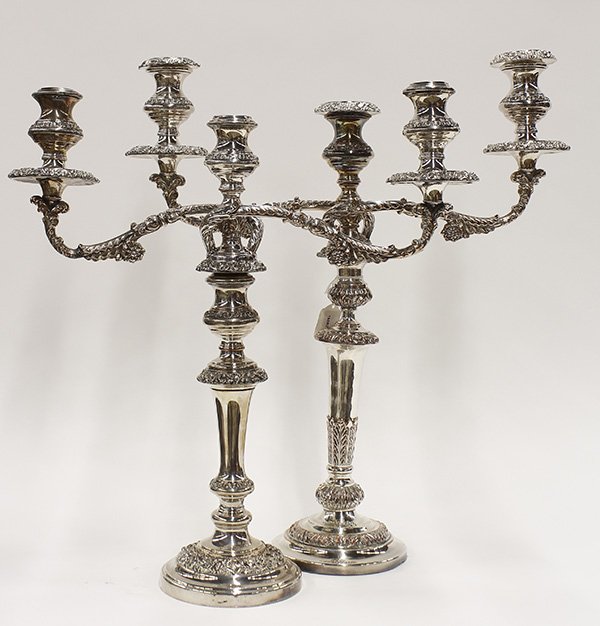 Pair of Sheffield silver plate three light candelabra: Pair of monumental Sheffield silver plate three light convertible candelabra, each having floral decorated bobeches, continuing to the scrolled branches, above the tapered standard with acanthus accen