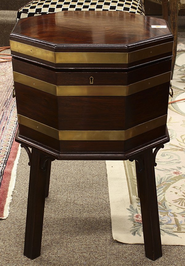 Georgian style mahogany cellarette: Georgian style mahogany cellarette, the highly figured octagonal top opening to the tin lined interior, the exterior with brass banding, and rising on square incised legs, 26.5"h x 18.5"w