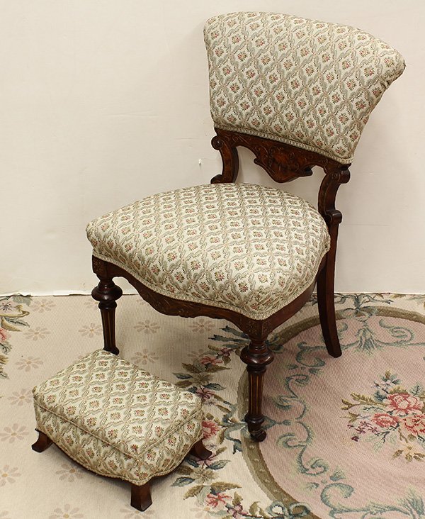 Victorian slipper chair: Victorian slipper chair, circa 1870, the upholstered seat and back rising on fluted and turned legs, terminating on casters; together with an ottoman, 33"h