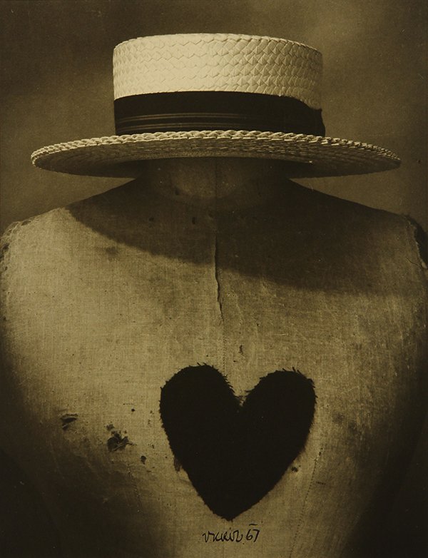 Photograph by Vilem Kriz .: Vilem Kriz (American/Czech, 1921-1994), Untitled (Straw Hat and Heart), gelatin silver print, signed and dated lower center, artist stamp verso, later reprint, sheet: 13.5"h x 11"w, overall (with mat)