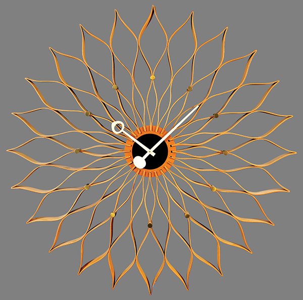George Nelson 'Sunflower' wall clock model 2261: George Nelson 'Sunflower' wall clock model 2261, executed by Howard Miller Clock Co., circa 1950, having a laminated walnut body with birch accents, fronted by enameled aluminum hands, 29.5"w