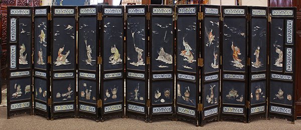 Chinese Twelve Panel Lacquered Screen: Chinese small twelve panel lacquered folding-screen inset with porcelain panels, the central panels decorated with various figures including the Eight Daoist Immorals, Mother of the West, Shoulao and 