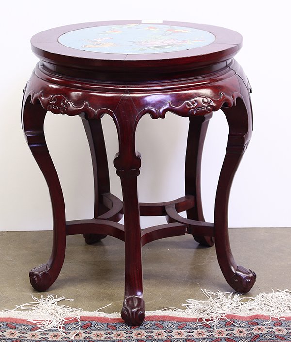 Chinese Cloisonne Top Wood Stool: Chinese wood stool with a cloisonne enameled top, featuring a recumbent deer and various auspicious foliage, above the apron carved with bat and with cabriole supports, 20"h