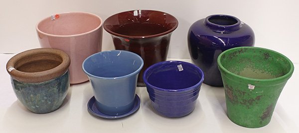 Pottery jardinieres: (lot of 7) Pottery jardinieres including Bauer blue ringware and pink flower pots; together with a Weller plant green flower pot; and a Preston Premier Pottery cobalt bulbous vase, largest: 9.5"h x 11