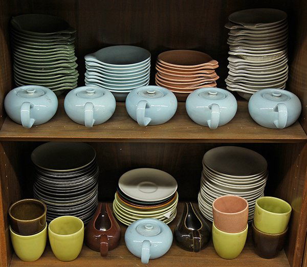 Russel Wright Steubenville pottery tableware: (lot of approx 150) Collection of Russel Wright Steubenville pottery tableware in grey, nutmeg, turquoise, light blue, chartreuse, and brown including cups, mugs, creamers, covered sugar bowls, pitche