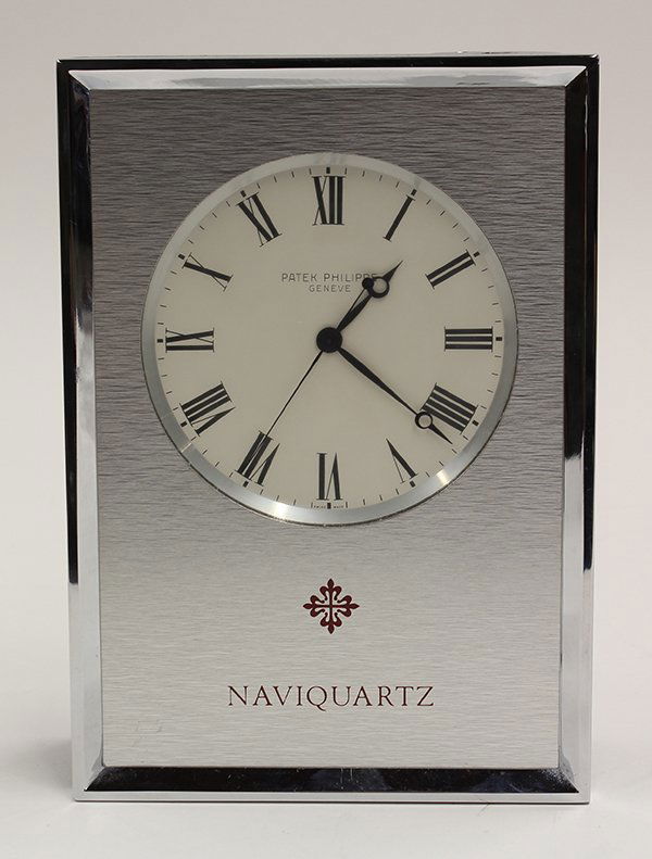Patek Philippe Naviquartz desk clock: Patek Philippe, Geneva Switzerland, Naviquartz desk clock, series E 1200, serial number 801074, the white dial having Roman markers with Patek Philippe Geneve, the brushed case with Patek Philippe mon