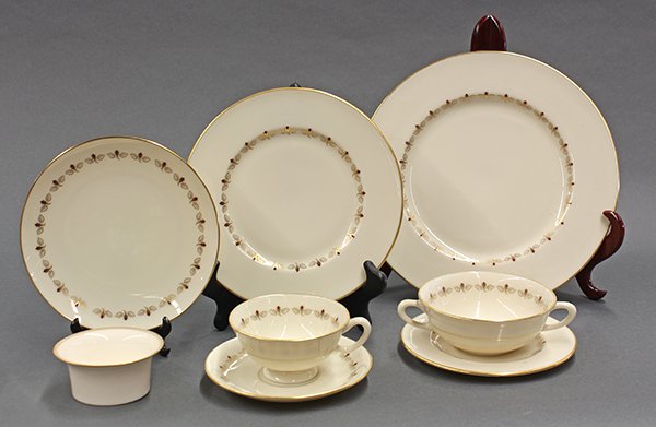 Lenox partial table service for twelve in the "Romance": (lot of 67) Lenox partial table service for twelve in the "Romance" pattern having a gilt floral border consisting of (12) dinner plates; (12) salad plates; (12) bread plates; (10) dessert plates; (12