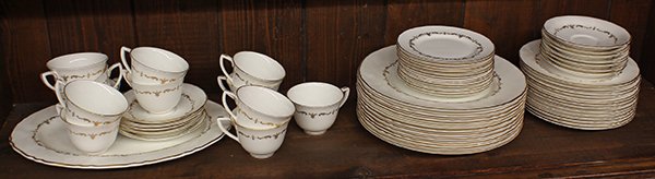 Royal Worcester table service for twelve: (lot of 61) Royal Worcester table service for twelve, executed in the Gold Chantilly pattern, each decorated with a gilt rim centering the scrollwork border, including; (12) dinner plates 10.75''dia.,