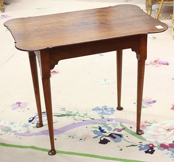 Eldred Wheeler Queen Anne style porringer tea table: Eldred Wheeler Queen Anne style porringer tea table, the shaped top rising on cabriole legs ending in pad feet, 27"h x 32.5"w x 21.5"d