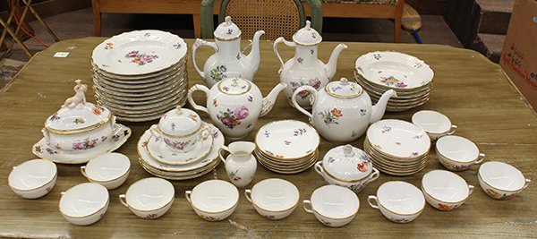 Royal Copenhagen partial table service: (lot of 43) Royal Copenhagen and B & G assembled partial table service having a gilt rim centering the polychrome decorated floral design on a white ground, consisting of (12) salad plates; (6) bowls;