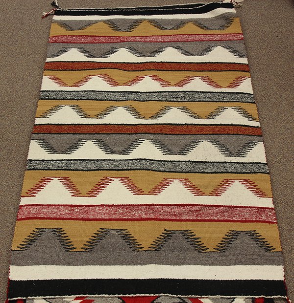 (lot of 2) Navajo blanket group: (lot of 2) Navajo blanket group, consisting of two Eye Dazzler weavings, 5'8" x 2'9", and 4'8" x 2'11". Provenance: From the estate of Edward Gerber
