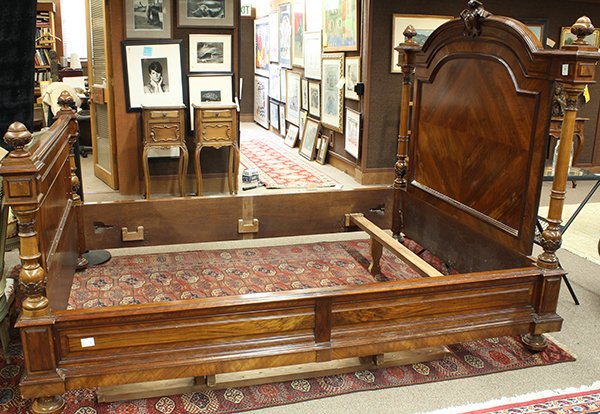 French Renaissance rosewood and walnut burl bed: French Renaissance rosewood and walnut burl bed, 19th century, having a carved medallion centering the raised burl panels surmounting the bookmatched headboard flanked with turned pilasters, and risin