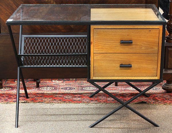 Pacifica desk designed by Muriel Coleman: Pacifica desk designed by Muriel Coleman for California Contemporary Co., with a glass top below an exoskeletal iron frame, supporting a teak case divided equally between two drawers, iron tube pulls,