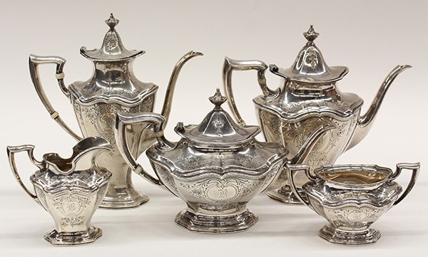 Reed & Barton sterling silver five piece hot beverage: (lot of 5) Reed & Barton sterling silver hot beverage service in the 'Hepplewhite Engraved' pattern, of Classical form, each piece has floral engraving centering reserves with monograms, consisting of