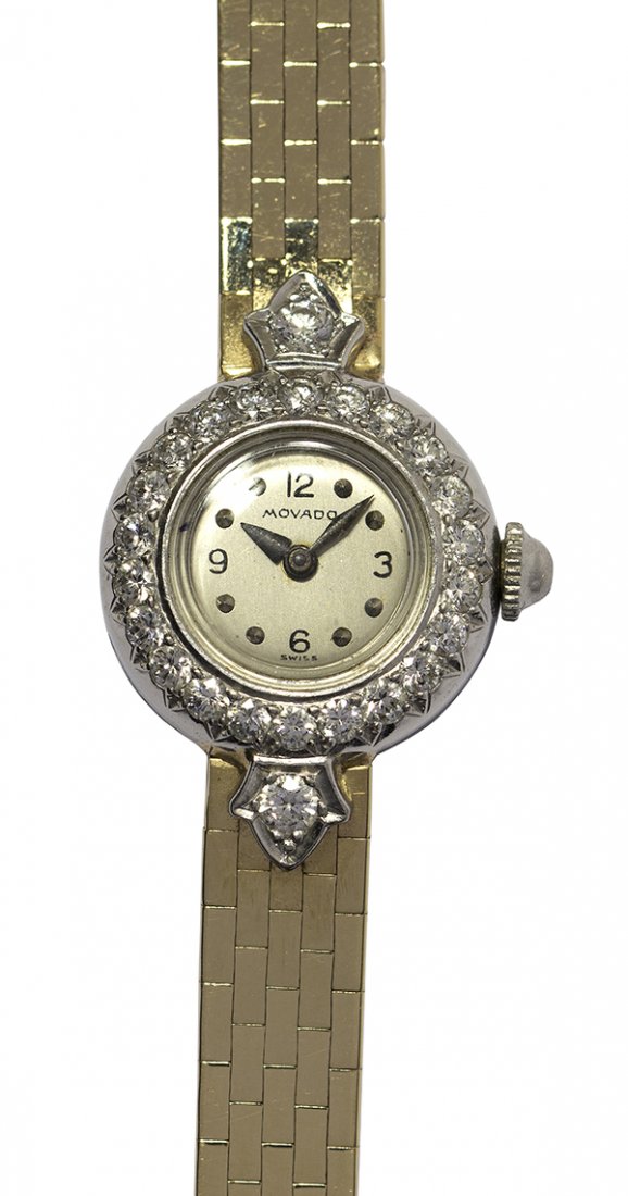 Lady's Movado diamond, platinum and 14k yellow gold: Lady's Movado diamond, platinum and 14k yellow gold wristwatch 17 jewel manual wind movement by Movado within a round platinum case #0153516048, 18.4 mm, set with twenty-four full cut diamonds totalin