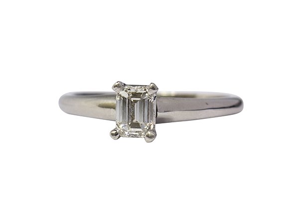 Diamond and platinum ring: Emerald cut diamond and platinum ring centering one emerald cut diamond weighing approximately 0.47 ct., set in a four-prong solitaire mounting, size 6 1/2, 3.6 grams