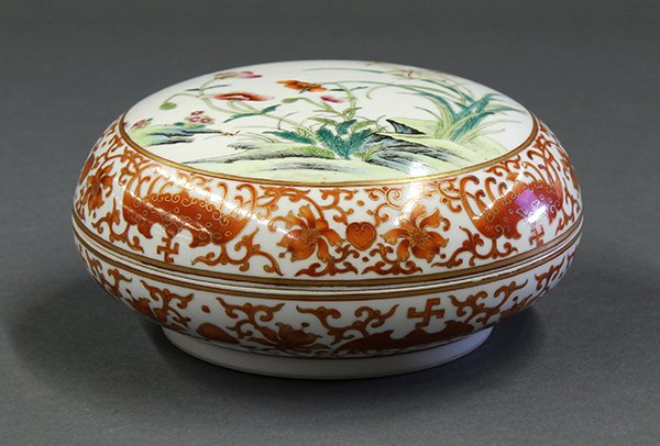 Chinese Enamel Circular Box: Chinese enameled porcelain covered box, the circular domed lid featuring poppies and lillies within a band of gilt red bats, the box decorated en suite, the base with apocryphal 'Shen De Tang Zhi' mar