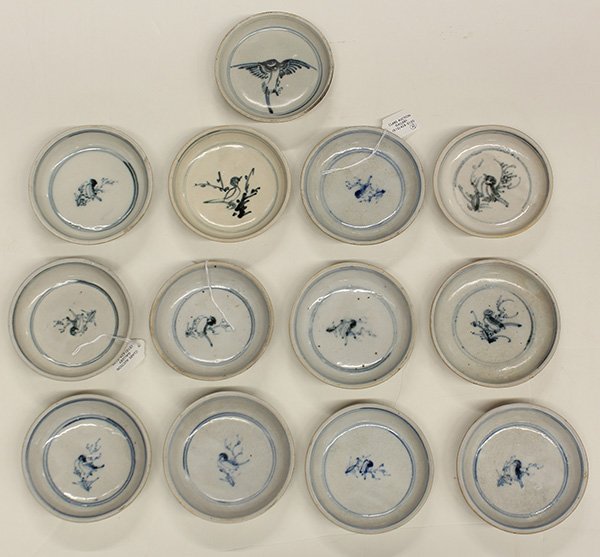 Vietnamese Porcelain Dishes: (lot of 29) Vietnamese blue and white porcelain dishes, 15th/16th century, each with a bird to the center and lotus pattern to the exterior, from the Hoian Hoard, largest: 5.25" Provenance: Buttterfie