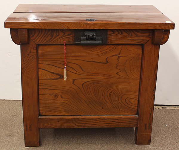 Korean Rice Storage Chest, 19c: Korean rice storage chest (ssal tuiju) with zelkova front panel, 19th century, the upper inset with a separate lid, the front and sides set with recessed panels accented by shaped spandrels, with iron