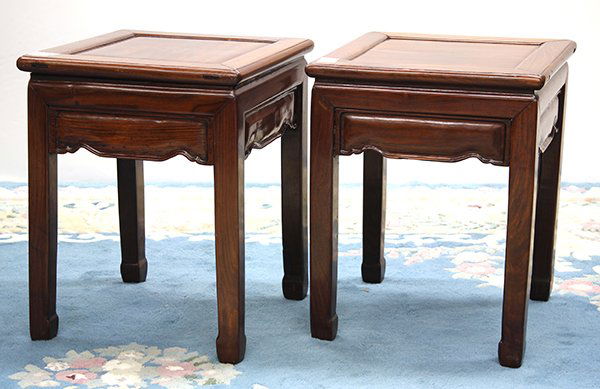 Two Chinese Wood Stools: Pair of Chinese hardwood square stools, with an inset top panel above a shaped apron, joined to straight supports with hoof terminals, 20.25"h x 16"w x 16"sq