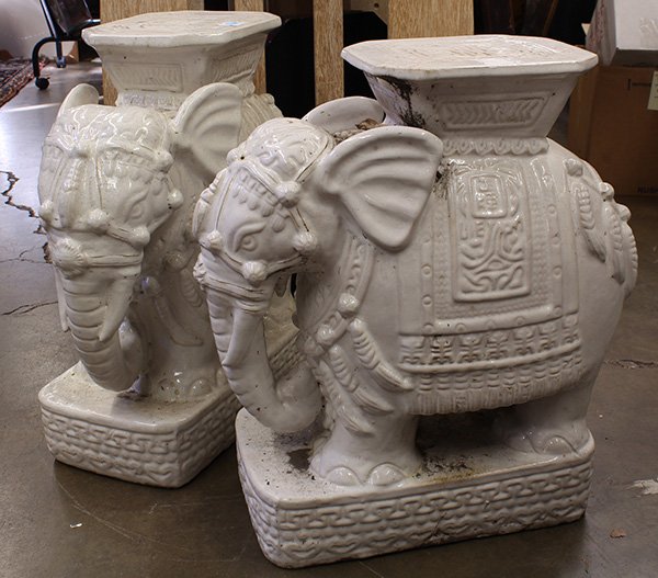 Two Chinese Elephant Garden Seats: Pair of Chinese ceramic garden stools, the white elephants each supporting the octagonal seats, 23"h