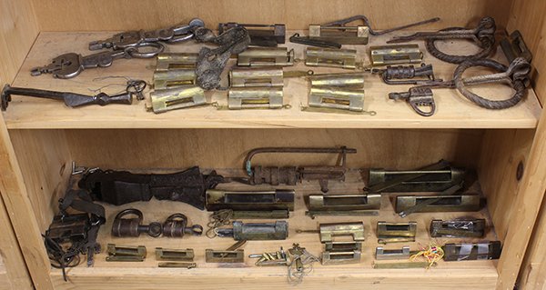 Group of Asian Locks: Two shelves of Asian locks and keys, of various forms and styles, largest: 10"w; Provenance: From the estate of Edward Gerber