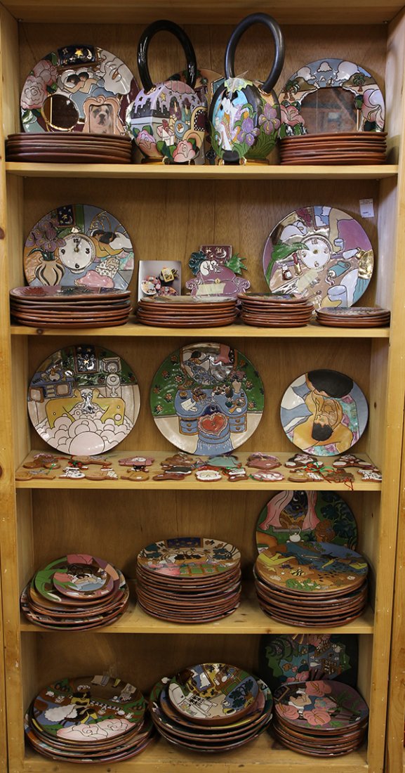 Collection of Judy Miller pottery: Collection of Judy Miller pottery, each hand constructed piece depicting various colorful domestic scenes of couples, families, and friends sharing different activities, inlcuding chargers, plates, te