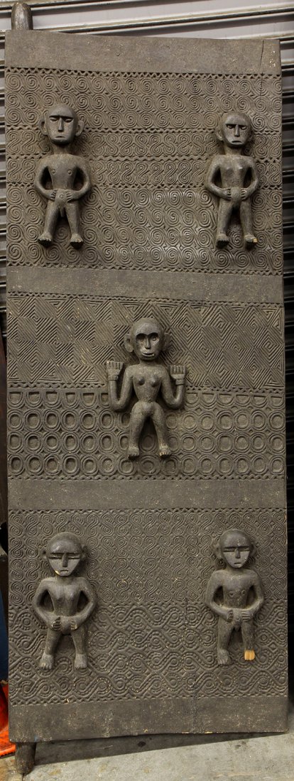 Timor style, Indonesia carved wood door, second-half: Timor style, Indonesia carved wood door, second-half 20th century, the decorative heavy panel having pronounced figures, 85"h. Provenance: From the estate of Edward Gerber