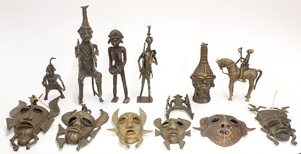 West African decorative brass sculptures: (lot of 13) West African decorative brass sculptures, including masks with horns, and six figural sculptures including one on horseback, largest: 13"l. Provenance: From the estate of Edward Gerber