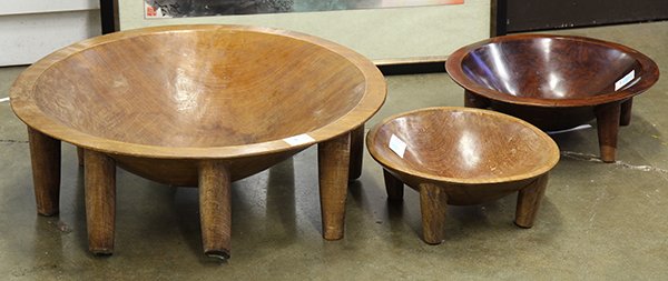 Figi or Tonga, Polynesia carved kava bowls: (lot of 3) Fiji or Tonga, Polynesia carved kava bowls, each with abstract turtle heads, the tapering legs are well adzed and patinated, probably mid-20th century, largest: 8.5"h x 25.5"diam.
