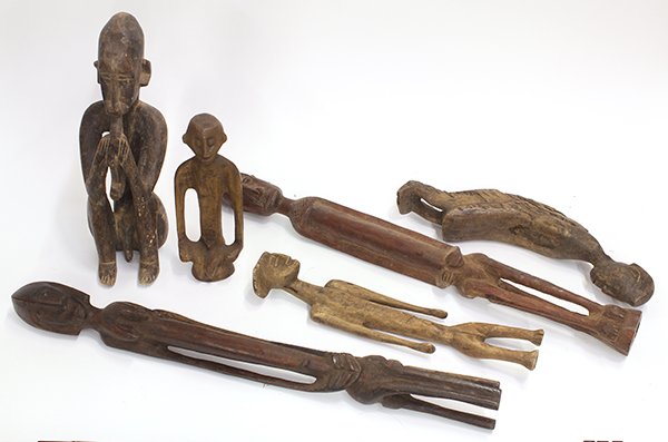 West African figural wood carvings: (lot of 6) West African figural wood carvings, having a non-traditional decorative designs, some figures depicted standing, others seated, largest: 27"l Provenance: From the estate of Edward Gerber