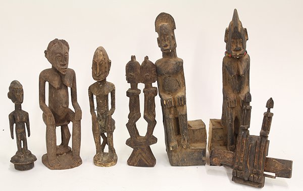 Dogon-style, Mali decorative carved wood figural: (lot of 6) Dogon-style, Mali decorative carved wood figural sculptures, several depicting females seated on stools, three depicting pairs, largest: 16"h Provenance: From the estate of Edward Gerber