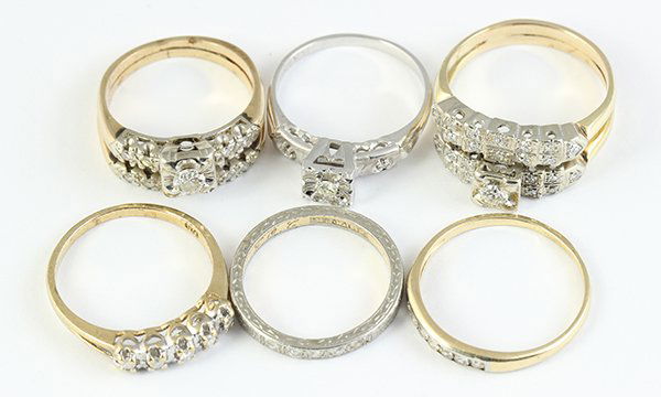 Collection of diamond and gold wedding rings: Collection of diamond and gold wedding rings including two diamond, 14k yellow and white gold soldered wedding sets; a diamond and 14k white gold engagement ring; a diamond, 18k yellow gold (platinum