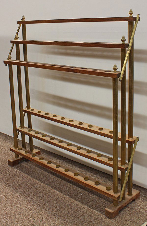 Cane rack: Cane rack, executed in wood and brass, having three tiers with holes for canes and cups for the tips, supported by brass rods with acorn finials, holds (32) canes, 3'4"h x 3'w x 10"d