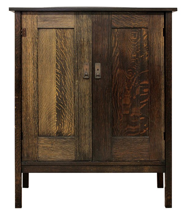 American Arts and Crafts wardrobe, executed in: American Arts and Crafts wardrobe, executed in quartersawn white oak by L & J.G Stickley, the two panelled doors opening to the fitted interior with four drawers over the shaped slide out compartments