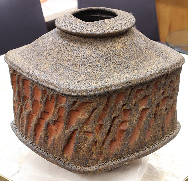 Ceramic studio vessel by Charles Gluskoter, executed in: Ceramic studio vessel by Charles Gluskoter, executed in stoneware with embossed decoration and waist and crackle glaze, 13.5"h x 11.5"sq. Provenance: From the estate of Edward Gerber