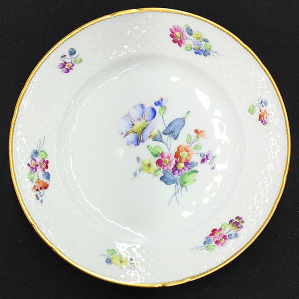 Royal Copenhagen partial flatware service for sixteen: (lot of 122) Associated Danish partial flatware service for sixteen, mostly by Bing and Grondahl having polychrome floral decoration, within a gilt decorated border, consisting of dinner plates, 10.25