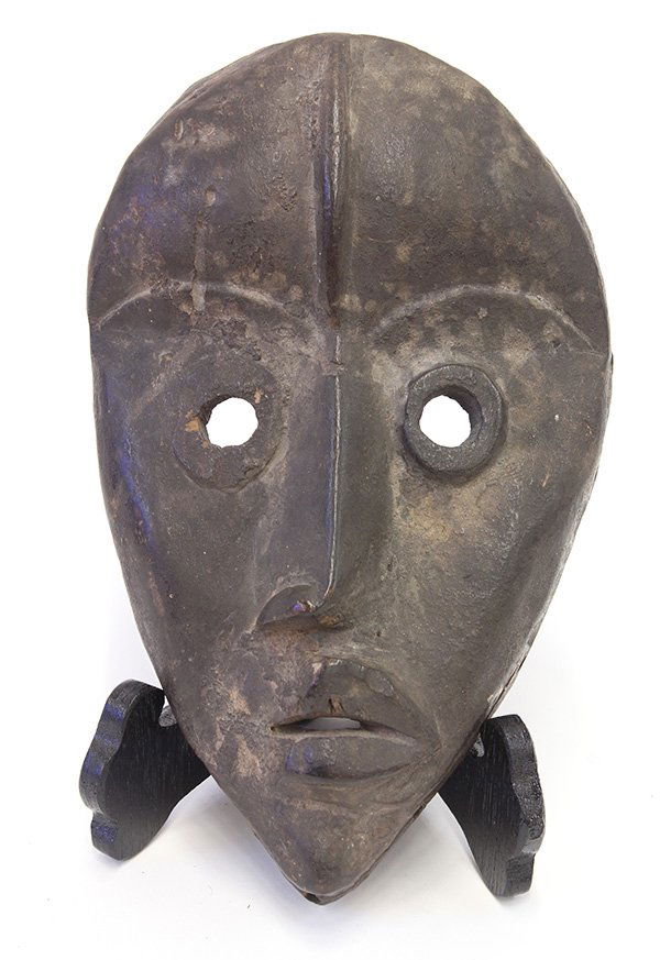 Dan, Liberia mask: Dan, Liberia, carved wood face mask, early/mid 20th century, having a ridged forehead and circular eyes, old wear on back, loss to side of nose and side of lips, museum accession number 2007.573, 9"h