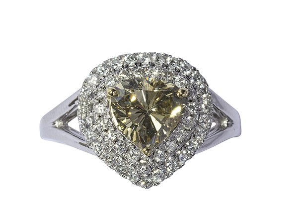 Fancy brownish yellow diamond and near colorless: Fancy brownish yellow diamond and near colorless diamonds ring centering one modified heart shaped brilliant cut diamond weighing approximately 1.63 cts., accompanied by a GIA Colored Diamond Grading 