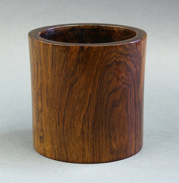 Chinese Huanghuali Brush Pot: Chinese huanghuali wooden brush pot, with thick walls and a slightly tapering body, the well centered with a large plug, 6.125"h. Provenance: From the estate of Edward Gerber